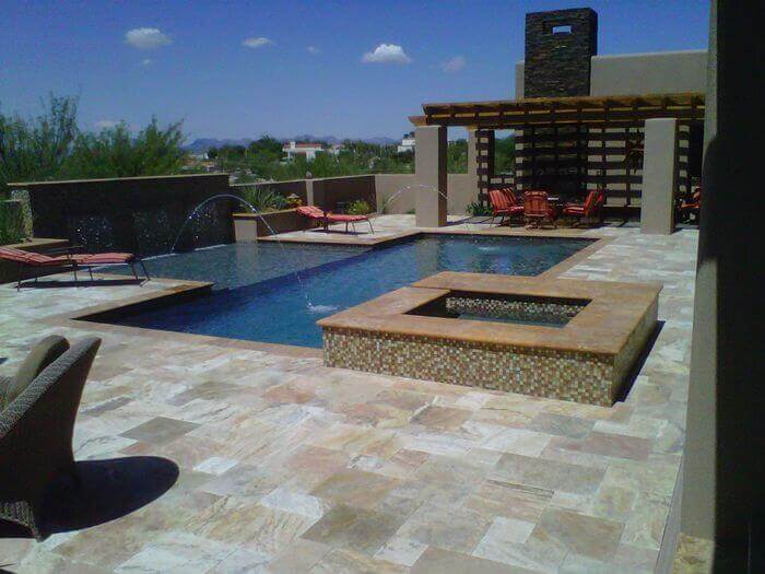 Pool with a luxurious concrete tiles by Saguaro Pool